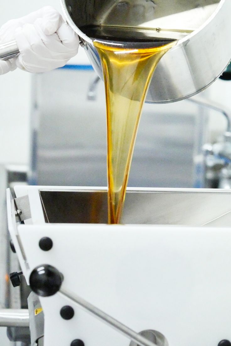Oil pouring into a mixer in the kitchen