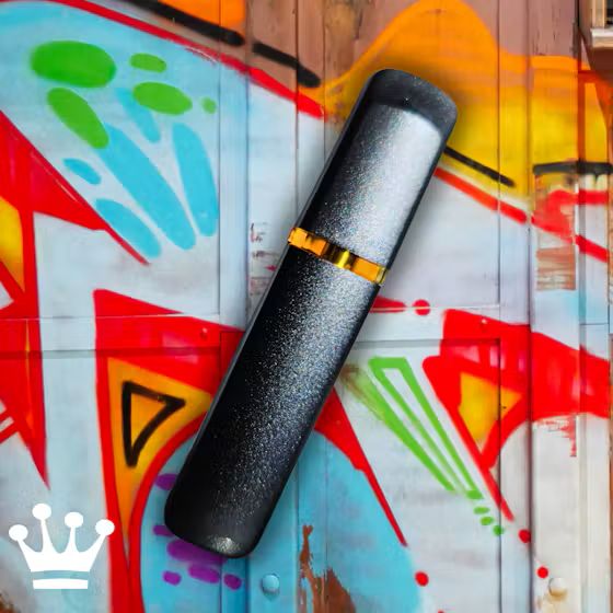 Kind & Co disposable vape against a graffiti wall